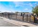 Inviting single-story home with secure fencing, complemented by minimalist landscaping for a clean, modern appeal at 5069 Hallet Dr, Las Vegas, NV 89122