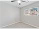 Cozy bedroom with neutral carpet and a window providing natural light at 5116 Iron Crossing Ave, Las Vegas, NV 89131