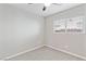 Simple bedroom with neutral carpet and a window providing natural light at 5116 Iron Crossing Ave, Las Vegas, NV 89131