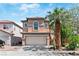 Charming two-story home with a well-maintained front yard and desert landscaping at 5116 Iron Crossing Ave, Las Vegas, NV 89131