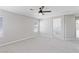 Spacious main bedroom with neutral carpet, dual windows, and an ensuite bathroom at 5116 Iron Crossing Ave, Las Vegas, NV 89131