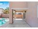 Covered patio area with access to the pool, offering a perfect spot for outdoor relaxation and entertaining at 5116 Iron Crossing Ave, Las Vegas, NV 89131