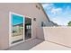 Covered outdoor patio with a large sliding glass door offering an indoor-outdoor flow at 5116 Iron Crossing Ave, Las Vegas, NV 89131
