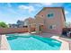 Inviting backyard featuring a private pool, spa, and covered patio area at 5116 Iron Crossing Ave, Las Vegas, NV 89131