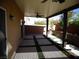 Covered back patio with ceiling fans, patterned concrete, and landscaped planters at 5889 Thistle Meadow Ave, Las Vegas, NV 89139