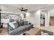 Finished basement with a cozy seating area, built-in cabinets, and a laundry area at 5889 Thistle Meadow Ave, Las Vegas, NV 89139