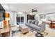 Open-concept basement area with a plush sofa, outdoor access, and built in shelving at 5889 Thistle Meadow Ave, Las Vegas, NV 89139
