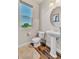 Small bathroom with a pedestal sink, toilet, and plush rug at 5889 Thistle Meadow Ave, Las Vegas, NV 89139