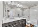 Bathroom with dual-flush toilet, shower-tub combination, and single sink vanity at 5889 Thistle Meadow Ave, Las Vegas, NV 89139