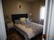 Comfortable bedroom featuring a queen bed, neutral walls, and a window at 5889 Thistle Meadow Ave, Las Vegas, NV 89139