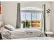 Well-lit bedroom featuring two beds and a window with neighborhood views at 5889 Thistle Meadow Ave, Las Vegas, NV 89139