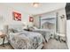 Cozy bedroom featuring two beds with decorative bedding and a bright window at 5889 Thistle Meadow Ave, Las Vegas, NV 89139