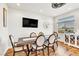 Elegant dining room with a modern table, comfortable seating, and a view of the outdoors, perfect for Gathering gatherings at 5889 Thistle Meadow Ave, Las Vegas, NV 89139