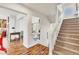 Inviting entryway with wood floors and staircase leading upstairs at 5889 Thistle Meadow Ave, Las Vegas, NV 89139