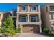 Charming two-story home boasts a well-maintained exterior with a brick driveway and attached two-car garage at 5889 Thistle Meadow Ave, Las Vegas, NV 89139