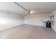 Spacious two-car garage with epoxy flooring and water heater at 5889 Thistle Meadow Ave, Las Vegas, NV 89139