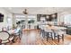 Open-concept kitchen & dining area with stainless appliances, granite countertops, and bright, airy feel at 5889 Thistle Meadow Ave, Las Vegas, NV 89139