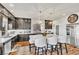 Well-equipped kitchen with stainless steel appliances, granite countertops, and a large island with seating at 5889 Thistle Meadow Ave, Las Vegas, NV 89139
