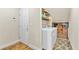 Laundry room with shelving, washer and dryer, and hard surface flooring at 5889 Thistle Meadow Ave, Las Vegas, NV 89139