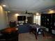 Bright living room featuring a ceiling fan, recessed lights, television, and a foosball table at 5889 Thistle Meadow Ave, Las Vegas, NV 89139