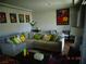 Comfortable living room showcases a sectional sofa, decorative pillows, and stylish artwork at 5889 Thistle Meadow Ave, Las Vegas, NV 89139