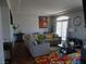 Comfortable living room with modern decor, a large sectional sofa, and a colorful area rug at 5889 Thistle Meadow Ave, Las Vegas, NV 89139