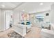 A cozy loft area features a sofa, desk, and unique wall decor at 5889 Thistle Meadow Ave, Las Vegas, NV 89139
