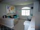Cozy loft space with comfortable seating, a work desk, and charming decor creating a relaxing ambiance at 5889 Thistle Meadow Ave, Las Vegas, NV 89139
