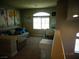 Cozy loft space with comfortable seating, a work desk, and charming decor creating a relaxing ambiance at 5889 Thistle Meadow Ave, Las Vegas, NV 89139