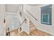 Bright staircase showcasing natural light, wood floors, and neutral tones, blending functionality with modern design at 5889 Thistle Meadow Ave, Las Vegas, NV 89139
