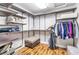 Spacious walk-in closet with custom shelving, hanging rods, and a padded bench at 5889 Thistle Meadow Ave, Las Vegas, NV 89139