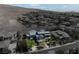 Breathtaking aerial view of an elegant home surrounded by desert landscape and mountains at 6 Yorkridge Ct, Henderson, NV 89052