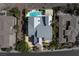 Luxury home boasts an attractive pool, landscaped garden, and meticulously kept grounds, captured from above at 6 Yorkridge Ct, Henderson, NV 89052