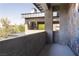 A concrete balcony with a view of the neighborhood featuring stone walls and metal roof at 6 Yorkridge Ct, Henderson, NV 89052