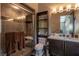 Bathroom featuring tiled walk-in shower, floating vanity, and modern fixtures at 6 Yorkridge Ct, Henderson, NV 89052