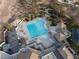 Aerial view of luxury pool featuring lap lanes, sun loungers and shaded seating at 6 Yorkridge Ct, Henderson, NV 89052