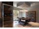 Elegant dining room featuring a wine fridge, stylish lighting, and a wooden table at 6 Yorkridge Ct, Henderson, NV 89052