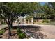 Gated community entrance with stone signage and manicured landscaping at 6 Yorkridge Ct, Henderson, NV 89052