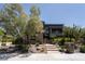 Modern multi-story home with stone accents, landscaped yard and paver steps to front door at 6 Yorkridge Ct, Henderson, NV 89052