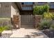 Elegant gated entry with stone accents and lush landscaping, providing security and curb appeal at 6 Yorkridge Ct, Henderson, NV 89052
