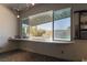 Contemporary game room with built-in table looking out to the pool area through a large open window at 6 Yorkridge Ct, Henderson, NV 89052