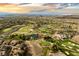 Scenic aerial view of a golf course with city and mountain views at 6 Yorkridge Ct, Henderson, NV 89052