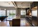 Modern kitchen boasts stainless steel appliances, sleek cabinetry, and a spacious island overlooking the pool at 6 Yorkridge Ct, Henderson, NV 89052