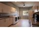 Large laundry room featuring white cabinetry, light countertop, and appliances at 6 Yorkridge Ct, Henderson, NV 89052