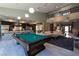 Expansive living area featuring a pool table, gourmet kitchen, and comfortable seating at 6 Yorkridge Ct, Henderson, NV 89052