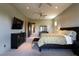 Inviting main bedroom featuring neutral walls, carpeted floors, TV, and furnishings providing a serene retreat at 6 Yorkridge Ct, Henderson, NV 89052