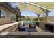 Outdoor patio features a fireplace, seating, an outdoor kitchen, and a refreshing pool at 6 Yorkridge Ct, Henderson, NV 89052