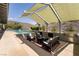 Inviting backyard patio with stylish seating, outdoor kitchen, and beautiful swimming pool at 6 Yorkridge Ct, Henderson, NV 89052