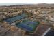 Aerial view of tennis courts, playground, and landscaped community at 6 Yorkridge Ct, Henderson, NV 89052