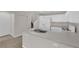 Bright kitchen with white cabinetry, essential appliances, and a convenient breakfast bar at 6284 Anticline Ave, Las Vegas, NV 89139